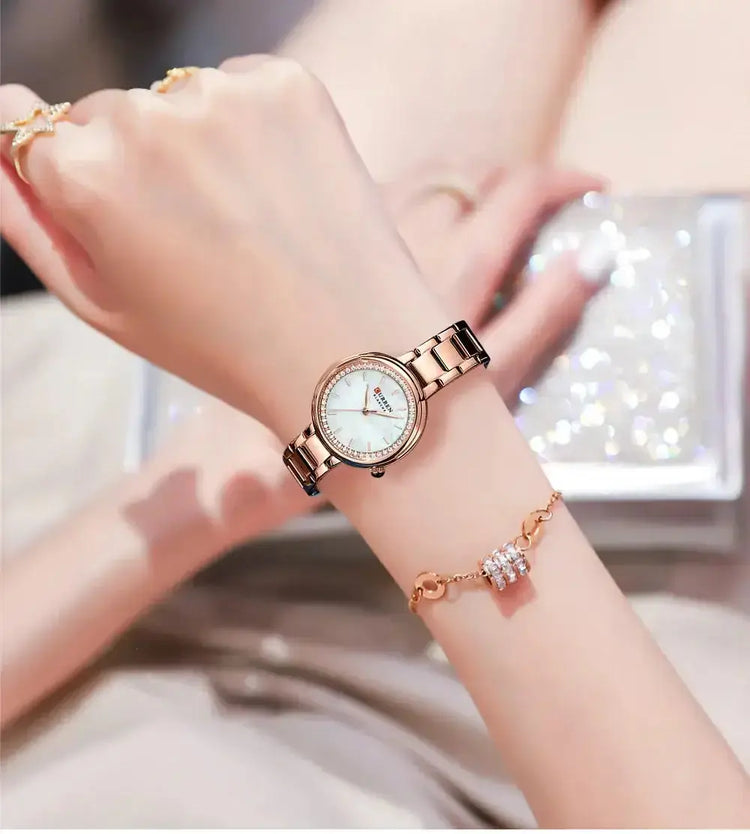 CURREN Luxury Watch Women Ring Necklace displayed on a women&